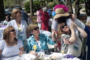 Kelley McHam Carlisle, right, receives a hug from her friend Renee Loggins during the brunch and champagne toast portion of the Alumnae Reunion Weekend Saturday, April 13 on Brenau University's historic Gainesville campus.