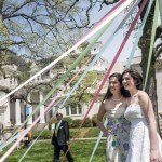 Tami Lee, Brenau University's director of special events, poses for a picture with her Alpha Chi Omega sorority sister and the 2013 May Queen Eleanor Kahn under the May Pole on the front lawn of the Gainesville campus. Lee offered her wedding dress to Kahn to use in the ceremony after Kahn expressed a concern about affording a wedding dress to use in the ceremony when Lee was encourageing her to run for May Queen. "Once she was elected we tried it on and it just fit perfectly," Lee said.