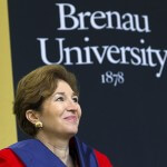 Brenau University commencement speaker Anne-Marie Slaughter smiles as University President Ed Schrader introduces her. Slaughter advised the graduating class to follow their hearts and "do what they want to do, not what they don't want to do."