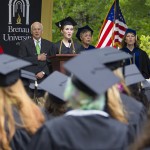 Kirstin Marsh leads the attendees at the 2013 Brenau University commencement exercises in the singing of the National Anthem.