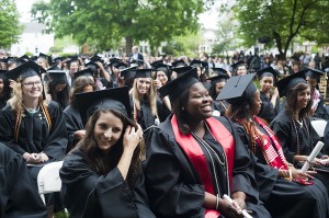 Shantél Francis, center, smiles after she and the rest of the 2013 Brenau University Women's College graduates moved their tassels across their hats signifying they have graduated.