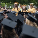 Katelin Mize, Ellen Peterson, and Abigail Umberger stand and are recognized as the last graduates earn a high school diploma through the Brenau University Early College Program.