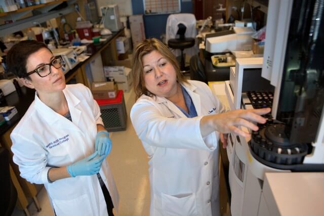 Dr. Dana Barr, right, and Rachel Golan, a post doctorate fellow, in a lab at Emory University.