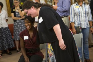 Occupational therapy doctoral students Chanequa Thomas, left, and Jennifer Allison share a moment during the reception for the first eight students in Brenau's new OTD program.