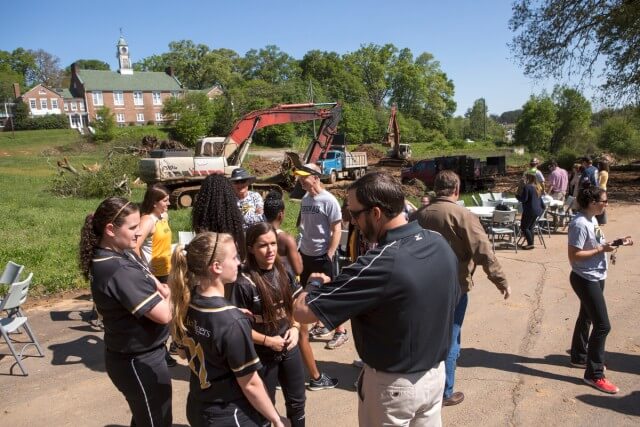 Brenau softball coach Devon Thomas talks with his players Elizabeth Schneider, Mason Garland and Allison Gunn during a lunch hosted for the Brenau student athletes at the site of the new Ernest Ledford Grindle Athletics Park, Brenau University's new athletic complex, that will serve the softball, soccer and track and field teams.