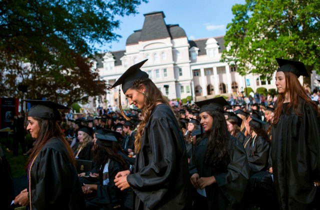 Dominika Jasova, center, walks to the podium during the 2015 Brenau Women's College Commencement. Jasova graduated with a Bachelor of Business Administration Degree.