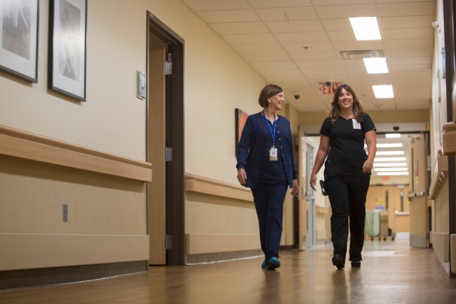 The Chappell duo head down a corridor in the Women and Children's Pavillion at Northeast Georgia Medical Center