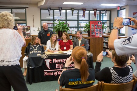 Flowery Branch senior Brooke Kimbrell signs her commitment to Brenau University alongside friends and family. Kimbrell is currently pegged for Brenau's new JV softball team but coach Gary Hatfield said that doesn't mean she won't play on the varsity squad.