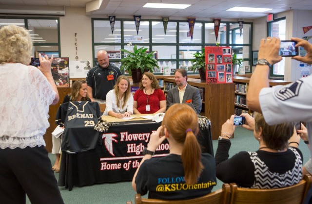 Flowery Branch senior Brooke Kimbrell signs her commitment to Brenau University alongside friends and family. Kimbrell is currently pegged for Brenau's new JV softball team but coach Gary Hatfield said that doesn't mean she won't play on the varsity squad.