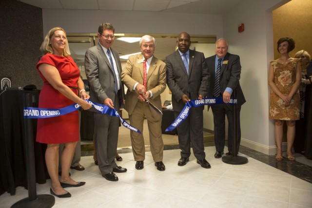 Brenau University President Ed Schrader cuts the ribbon at the school's new Jacksonville campus along side, Patty Wolfe, Brenau Trustee; Greg Anderson, Jacksonville City Council President ;Charles Moreland, Director of Community Affairs in the Office of the Mayor of Jacksonville; and David Barnett, CFO of Brenau University.