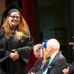 Ellie Anglin smiles as she meets Dr. Schrader on the stage of Pearce Auditorium during the 2015 Winter Undergraduate Commencement.
