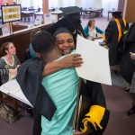 Brenau's Ann Marie Holman ,a graduate of the masters in gerontology program, hugs her son U.S. Army Communications Specialist Byron Brown her surprised her by coming to the graduation from Ft. Hood in Texas. Shes worked so hard, I just had to be here, Byron Brown said. I couldn't miss it.