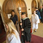 Dr. Vince Yamilkoski carries the scepter as the faculty recesses from commencement.