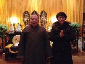 Autumn Zhao with the Abbot of the Buddhist temple she is helping to build near her hometown in China.