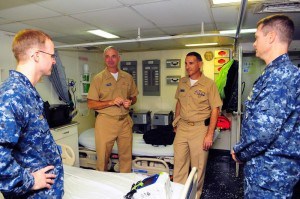 Of fewer than a dozen U.S. Navy fleet sureons from around the world. two are Brenau M.B.A health care alums: Capt. Chris Culp, in background from left, and Capt. Joel Roos.