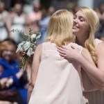 Logan Deyarmin gets a hug after being introduced at a member of the My Court during the Brenau University Alumnae Reunion Weekend on Saturday, April 16, 2016, in Gainesville, Ga. (AJ Reynolds/Brenau University)