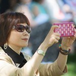 Professor Yuan Qiao from Anhui Normal University snaps pictures of Brenau University's May Court. 2016 Alumnae Reunion Weekend