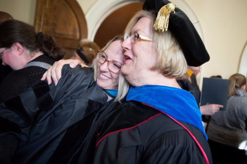 Dr. Sara Propes, newly minted Occupational Therapy Doctorate, laughs with Dr. Barbara Schell, director of the School of Occupational Therapy and associate dean of the College of Health Sciences, after the Brenau University College of Health Sciences Graduate Hooding Ceremony on Thursday, May 5, 2016. (AJ Reynolds/Brenau University)