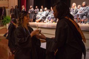 Christina MacCorkindale receives her lamp during the Brenau University School of Nursing Pinning Ceremony on Thursday, May 5, 2016 in Pearce Auditorium in Gainesville, Ga. (AJ Reynolds/Brenau University)
