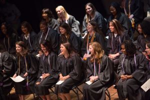 Students laugh on stage during the Brenau University School of Nursing Pinning Ceremony on Thursday, May 5, 2016 in Pearce Auditorium in Gainesville, Ga. (AJ Reynolds/Brenau University)
