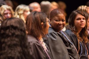 Shimi Barry on stage after being pinned during the Brenau University School of Nursing Pinning Ceremony on Thursday, May 5, 2016 in Pearce Auditorium in Gainesville, Ga. (AJ Reynolds/Brenau University)