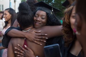 Nichele Nibbs, WC '16, gets a hug after The Women's College Commencement on Friday, May 6, 2016, in Gainesville, Ga. (AJ Reynolds/Brenau University)