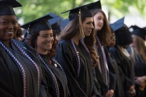 Shimi Barry, left, and Courtney Voss, both WC '16, laugh during The Women's College Commencement on Friday, May 6, 2016, in Gainesville, Ga. (AJ Reynolds/Brenau University)