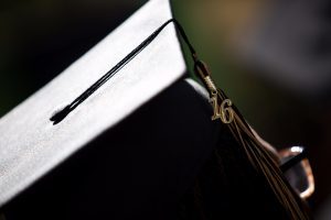 A graduate listens during The Women's College Commencement on Friday, May 6, 2016, in Gainesville, Ga. (AJ Reynolds/Brenau University)