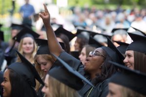 Dana Cole, WC '16, center, cheers as degrees are conferred during The Women's College Commencement on Friday, May 6, 2016, in Gainesville, Ga. (AJ Reynolds/Brenau University)