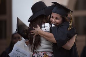 Kayla DelPizzo, WC '16, gets a hug after The Women's College Commencement on Friday, May 6, 2016, in Gainesville, Ga. (AJ Reynolds/Brenau University)