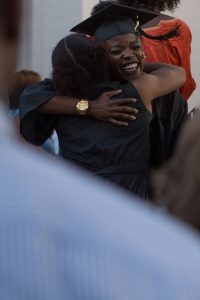 Olamide Sokunbi, WC '16, gets a hug after The Women's College commencement on Friday, May 6, 2016, in Gainesville, Ga. (AJ Reynolds/Brenau University)
