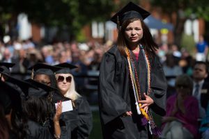Hannah Doster, WC '16, walks to the stage as a co-winner of the Cora Anderson Hill Academic Award during The Women's College commencement on Friday, May 6, 2016, in Gainesville, Ga. (AJ Reynolds/Brenau University)