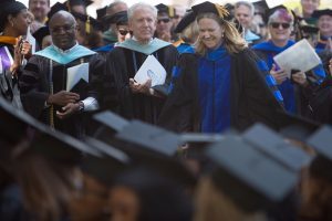 Kay Graham walks to the stage to accept the Ann Austin Johnson Outstanding Faculty Award during The Women's College commencement on Friday, May 6, 2016, in Gainesville, Ga. (AJ Reynolds/Brenau University)