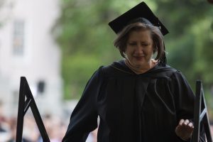 Alecia Webb walks to the stage to accept one of two Outstanding Part-Time Faculty Awards during The Women's College commencement on Friday, May 6, 2016, in Gainesville, Ga. (AJ Reynolds/Brenau University)