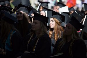 Alaina Troha, WC '16, and other graduates listen during The Women's College commencement on Friday, May 6, 2016, in Gainesville, Ga. (AJ Reynolds/Brenau University)