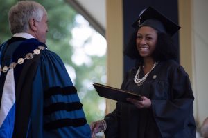 Cheyenne Candelario, WC '16, receives her Bachelor of Science in Nursing for Brenau President Ed Schrader during The Women's College commencement on Friday, May 6, 2016, in Gainesville, Ga. (AJ Reynolds/Brenau University)