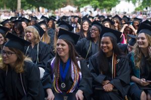 Graduates smile and laugh during The Women's College commencement on Friday, May 6, 2016, in Gainesville, Ga. (AJ Reynolds/Brenau University)