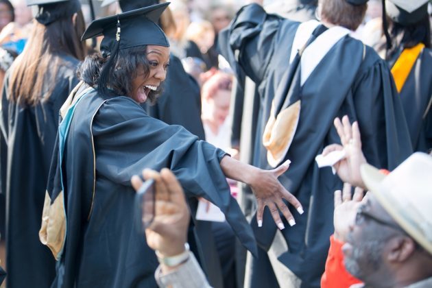 Winter Cardwell, who received a Master of Arts in Teaching degree, greets family and friends while during the processional during the Brenau University Undergraduate and Graduate Commencement on Saturday, May 7, 2016, in Gainesville, Ga. (AJ Reynolds/Brenau University)