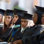 Ashjan Alyamani, a candidate for a Masters of Education degree, third from right, and other graduates listen to the commencement address during the Brenau University Undergraduate and Graduate Commencement on Saturday, May 7, 2016, in Gainesville, Ga. (AJ Reynolds/Brenau University)