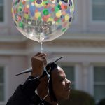 Mitchell Smith, BU '16, carries a congratulatory balloon after receiving an undergraduate degree and majoring in health sciences at the Brenau University Undergraduate and Graduate Commencement on Saturday, May 7, 2016, in Gainesville, Ga. (AJ Reynolds/Brenau University)
