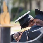 Greg Johnson and Romona Armstead hug after the Brenau University Undergraduate and Graduate Commencement on Saturday, May 7, 2016, in Gainesville, Ga. Johnson received a masters degree in project management and Armstead received a masters degree in organizational leadership. (AJ Reynolds/Brenau University)