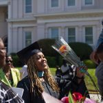 Kia Howell, an early childhood education masters graduate, gets a bouquet of flowers after the Brenau University Undergraduate and Graduate Commencement on Saturday, May 7, 2016, in Gainesville, Ga. (AJ Reynolds/Brenau University)