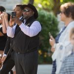 Family and friends take photographs of the processional during the Brenau University Undergraduate and Graduate Commencement on Saturday, May 7, 2016, in Gainesville, Ga. (AJ Reynolds/Brenau University)