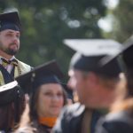 Michael Crouch, BU '16, stands to be recognized as a military veteran during the Brenau University Undergraduate and Graduate Commencement on Saturday, May 7, 2016, in Gainesville, Ga. (AJ Reynolds/Brenau University)