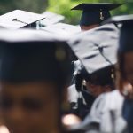 Graduates bow their heads for the benediction during the Brenau University Undergraduate and Graduate Commencement on Saturday, May 7, 2016, in Gainesville, Ga. (AJ Reynolds/Brenau University)
