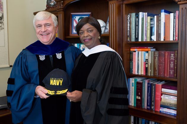 Brenau President Ed Schrader poses for a photo with retired Rear Adm. Annie Andrews, the 2016 commencement speaker, who engineered the experience of several college presidents aboard an aircraft carrier to encourage programs to recruit women into the U.S. Navy. (AJ Reynolds/Brenau University)