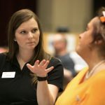 Brenau University occupational therapy graduate student Callie Setzer, left, asks a question of Spencer Wix, wife of former Shepherd Center patient Toy Wix. (Phil Skinner for Brenau University)