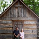 Joyce Lott, WC '59, right, and her husband Tom Lott pose for a photo in front of the church at the village on their farm on Tuesday, May 3, 2016, in Cleveland, Ga. (AJ Reynolds/Brenau University)