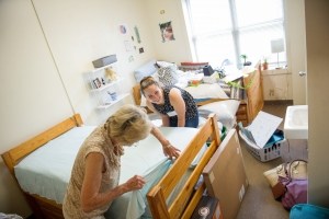 Cassidy Buck, a freshman special education major and dance minor, works with her grandmother Phyllis 'Mama' Engebretson to make up her room inside Van Hoose Hall. (AJ Reynolds/Brenau University)