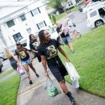 Quinnesha Turner, a senior from Winterville, Ga. and member of the baseketball team, helps new students move into Crudup Hall. (AJ Reynolds/Brenau University)(AJ Reynolds/Brenau University)